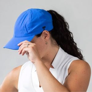 UNISEX TOP KNOT PERFORMANCE HAT